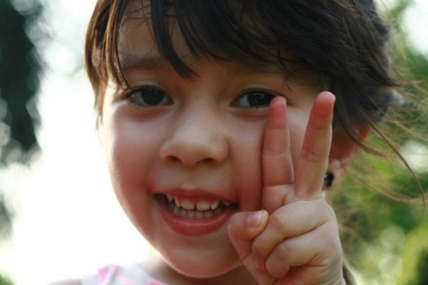 Close-up of Alba showing peace sign